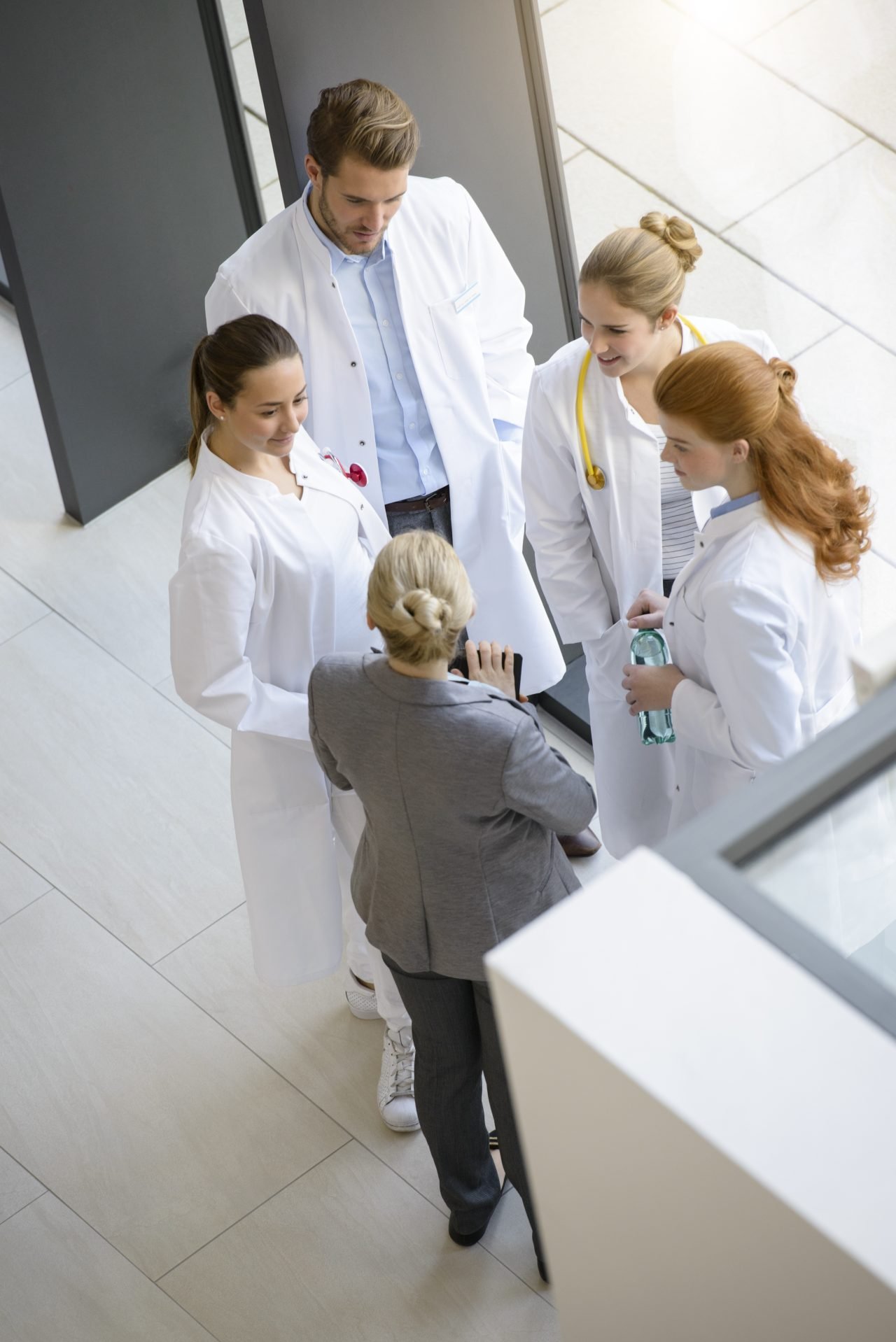 group-of-doctors-having-discussion-elevated-view